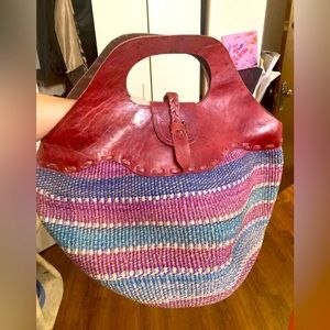 Handmade Kenyan sisal bag with leather braided top, handle and closure